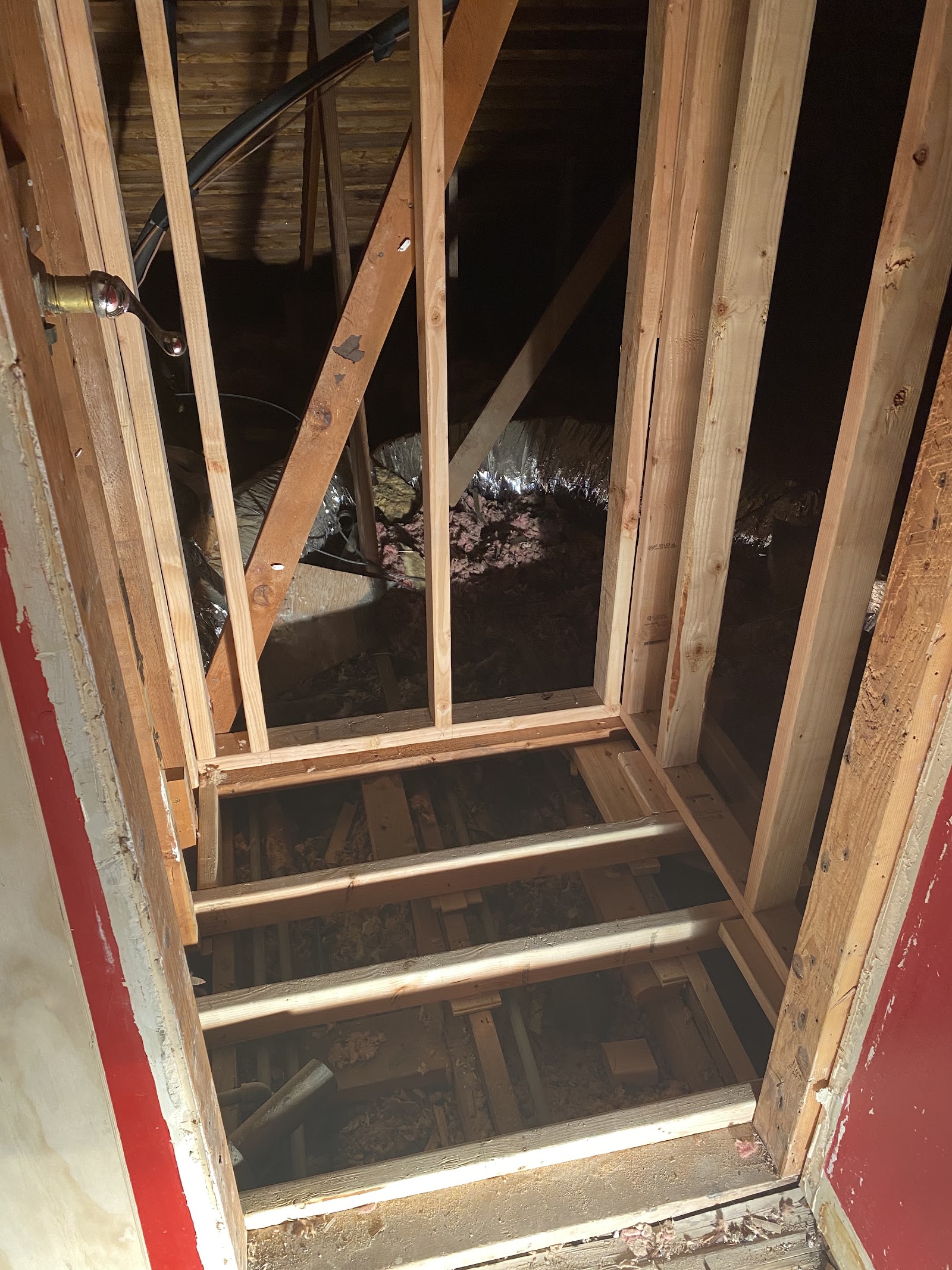 Structural wall framing tied into existing ceiling joists by LKP Woodworks