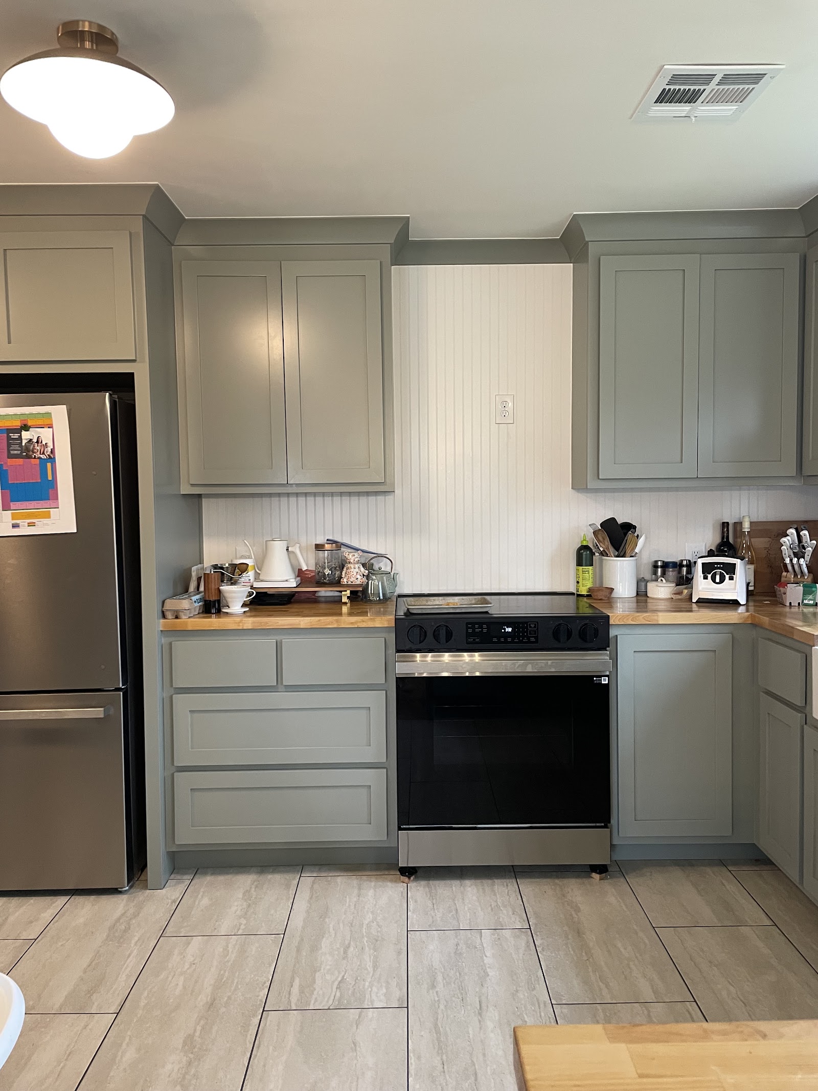 Kitchen cabinets finished with crown molding by LKP Woodworks in a remodeled kitchen