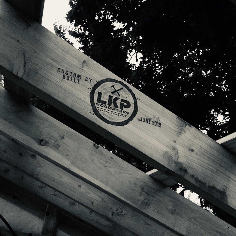 Deck framing lumber stamped with the LKP Woodworks custom built brand